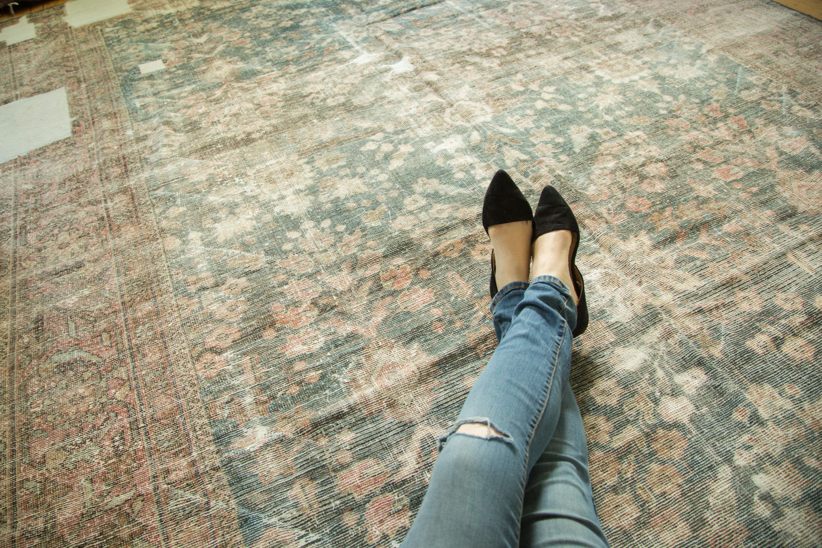 Hand-knotted Distressed Mahal carpet showing faded floral patterns and visible worn texture.